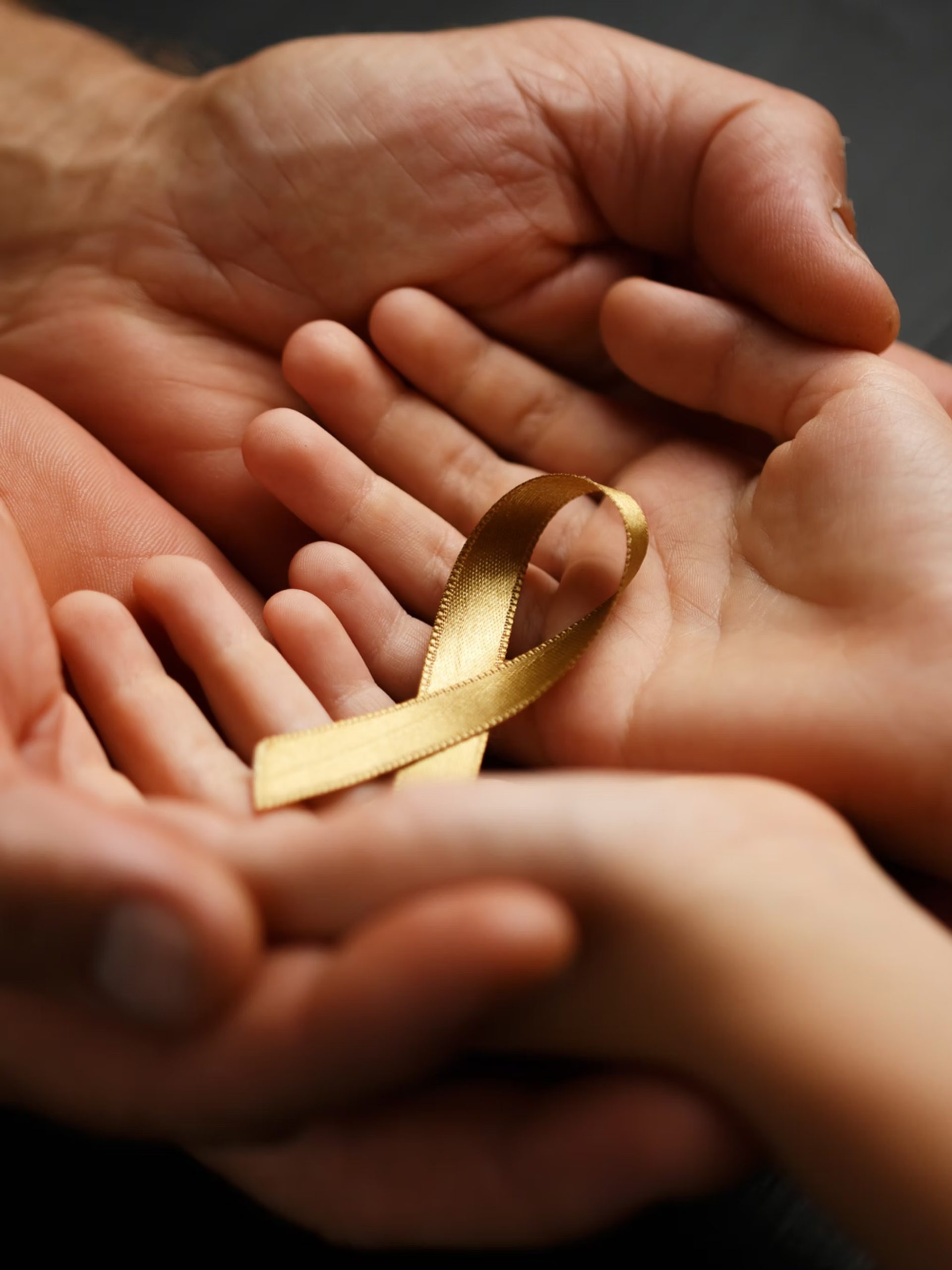Hands holding ribbon